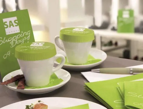 Branded SAS Shopping Days glass covers on coffee cups at a corporate event