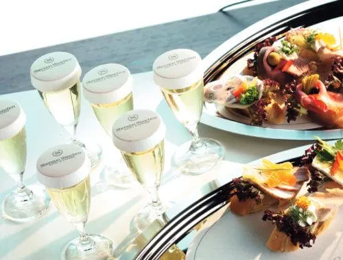 Sheraton branded stancaps on champagne flutes at a wedding reception